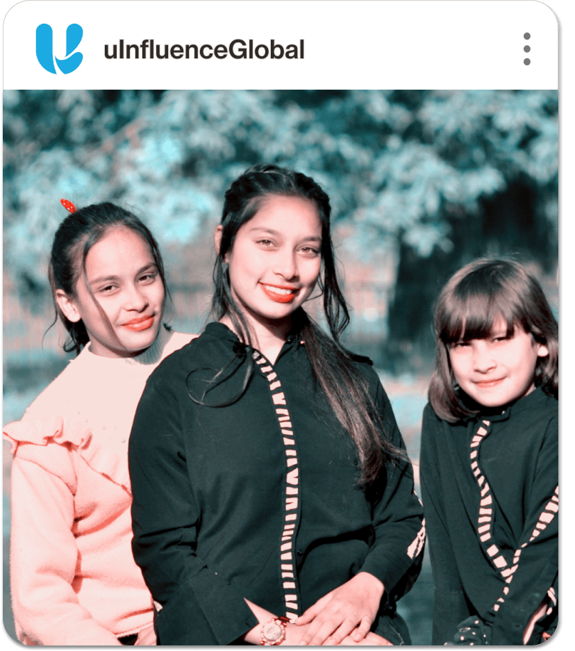 A photo of three smiling people on a social media feed